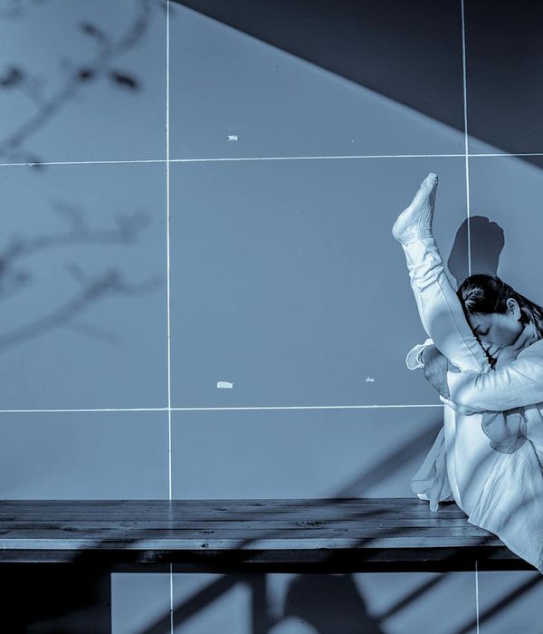 Woman in a graceful yoga pose focusing on pelvic balance, with serene expression.